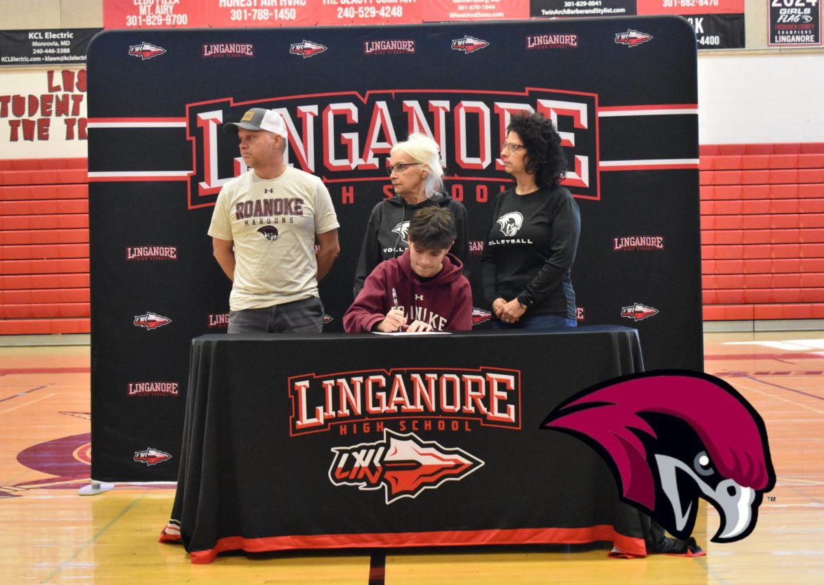 Garrett Turnbull signs his National Letter of Intent to continue playing volleyball at Roanoke College.