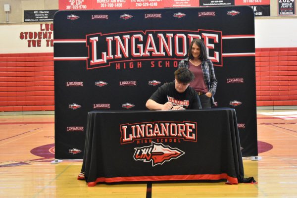 Issac Ferrari signs his  National Letter of Intent to play football at Seton Hill University.