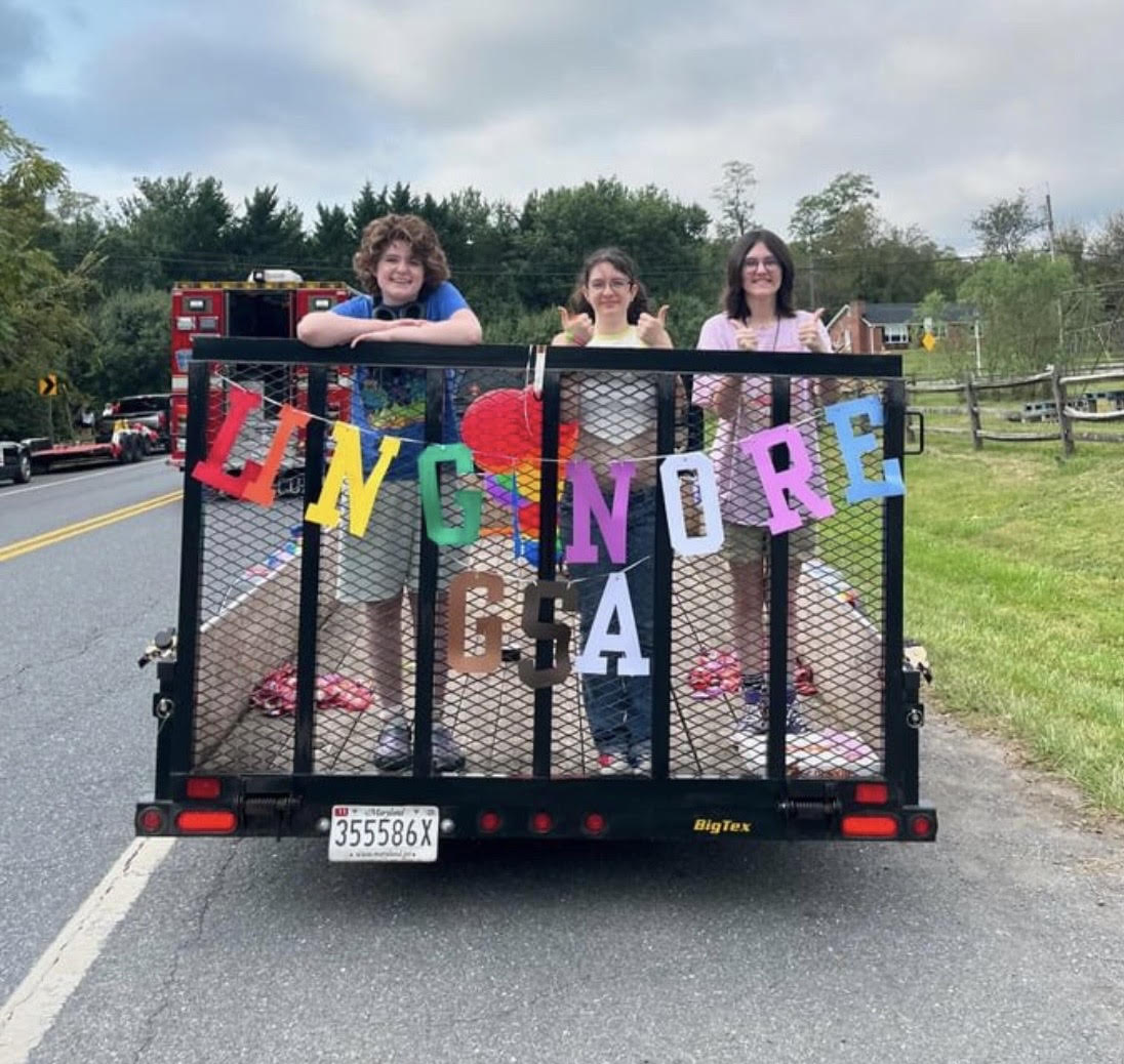 GSA officers Isabelle Zieg-Sniffen, Skye Basset and Millie Hamilton on the GSA Homecoming Parade float.