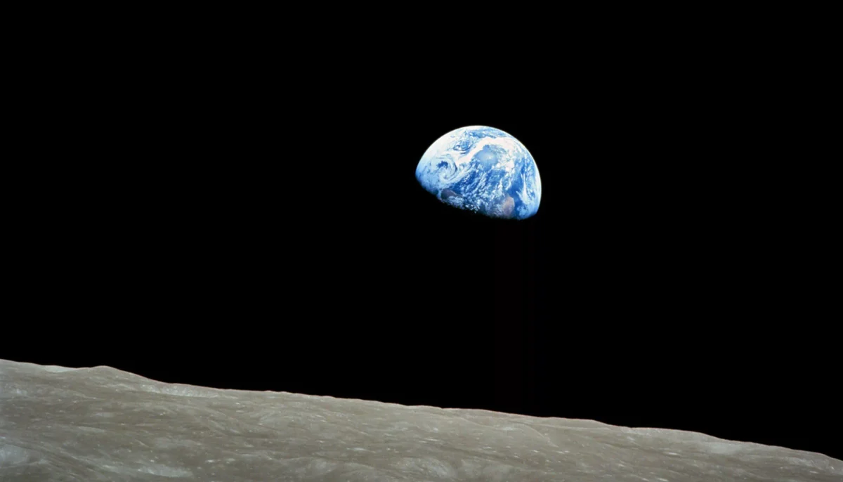 Apollo 8 was the first manned mission to the moon. On board, William Anders  took the featured photo. (Photo courtesy of NASA)