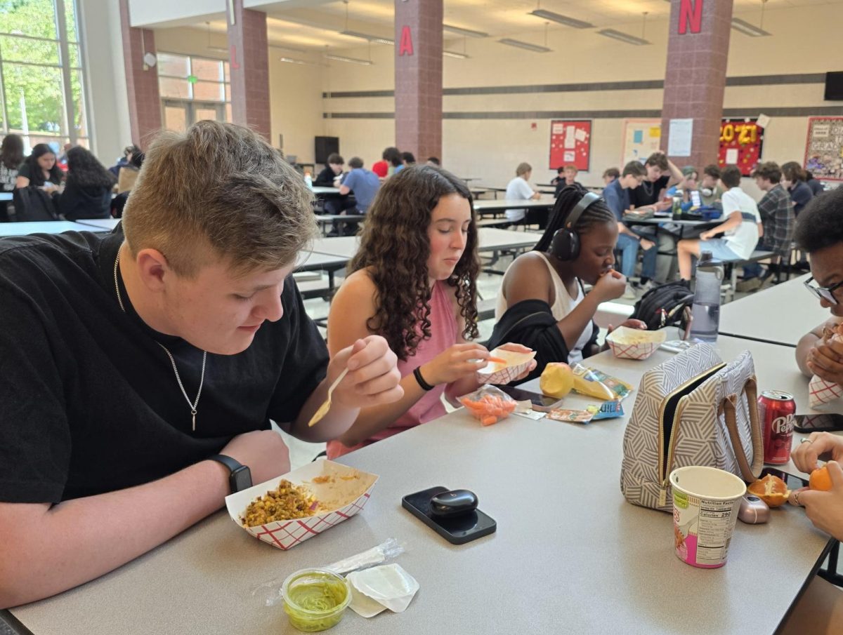 Linganore students eat their school-provided lunches in the cafeteria.