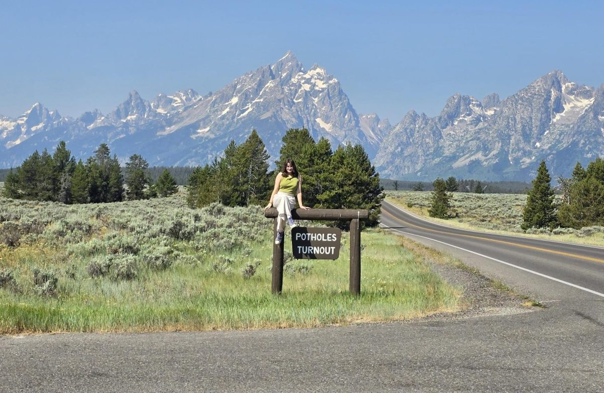 Jenna Ablondi admires the view of Grand Teton National Park in a road turnout. Overlooks like these are common in scenic national parks (Used with permission – Photo by Rachel Ablondi).